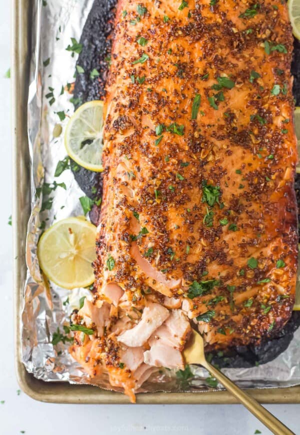 Honey mustard salmon with fresh parsley on top.