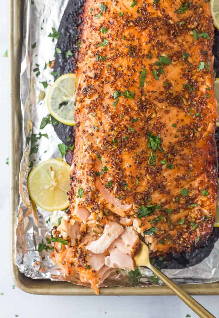 Honey mustard salmon with fresh parsley on top.