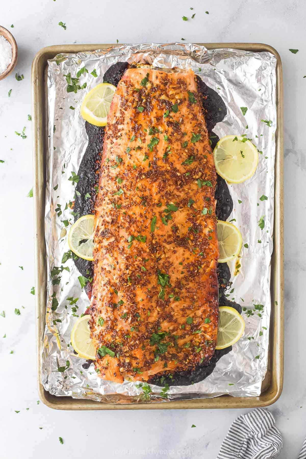 Baked salmon dinner in the baking tray.