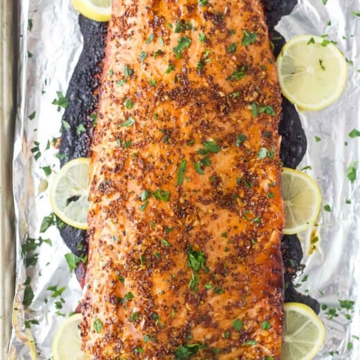 Whole baked salmon with honey mustard sauce.