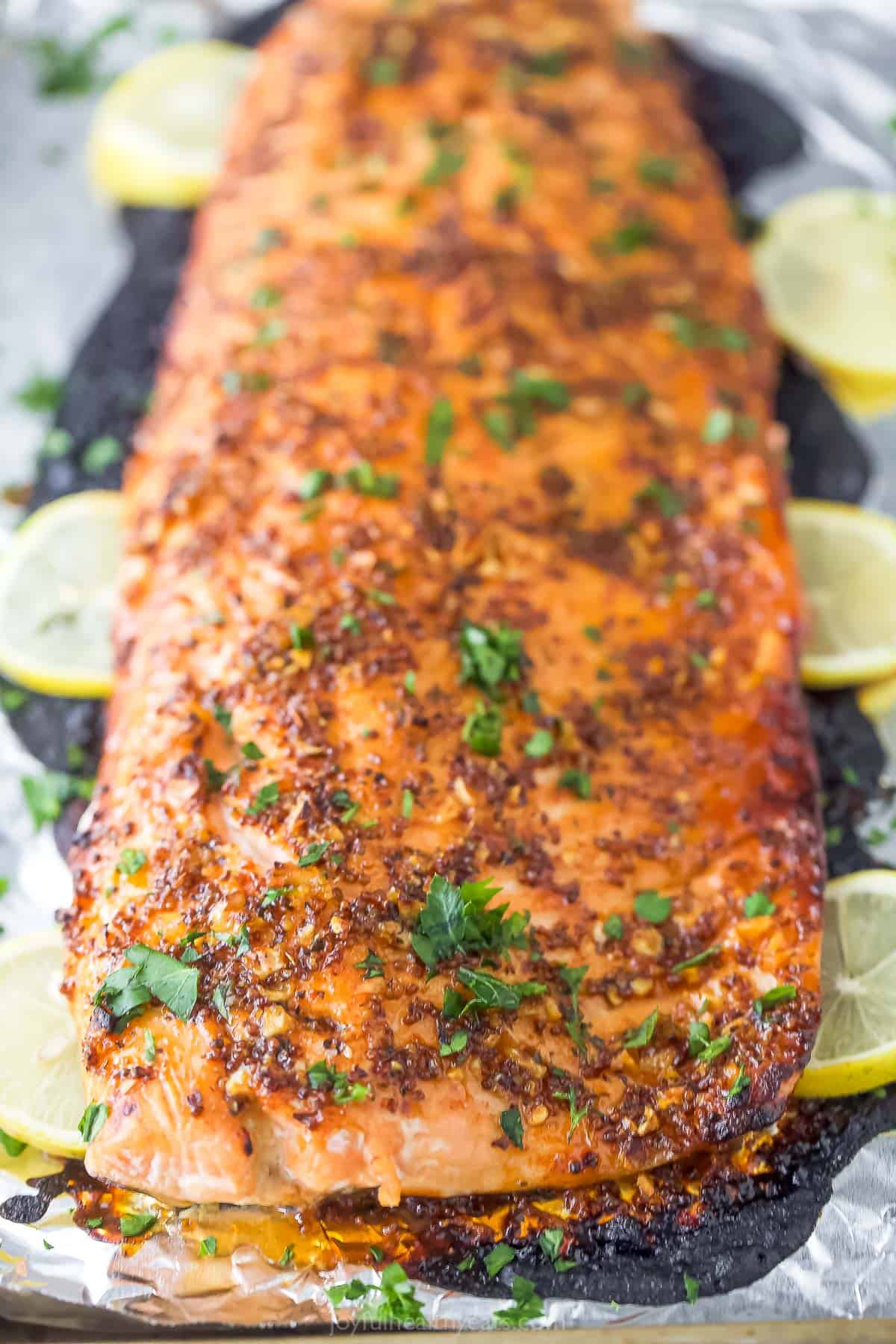 Whole honey mustard salmon with parsley on top. 