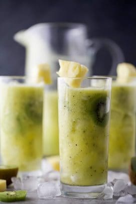 kiwi pineapple agua fresca in a cup with ice