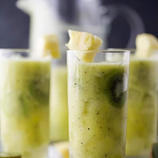 kiwi pineapple agua fresca in a cup with ice