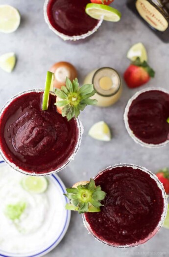 Fresh Berry Frozen Margaritas in a pitcher - loaded with sweet berries, agave, tequila, and fresh juices. It's the perfect party cocktail! These frozen margaritas are delicious, extremely smooth and fruity - guaranteed to be a crowd pleaser!