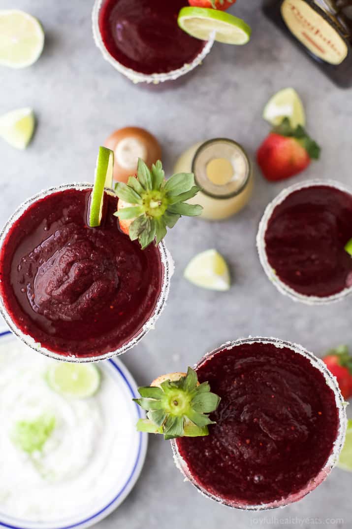 Fresh Berry Frozen Margaritas in a pitcher - loaded with sweet berries, agave, tequila, and fresh juices. It's the perfect party cocktail! These frozen margaritas are delicious, extremely smooth and fruity - guaranteed to be a crowd pleaser!