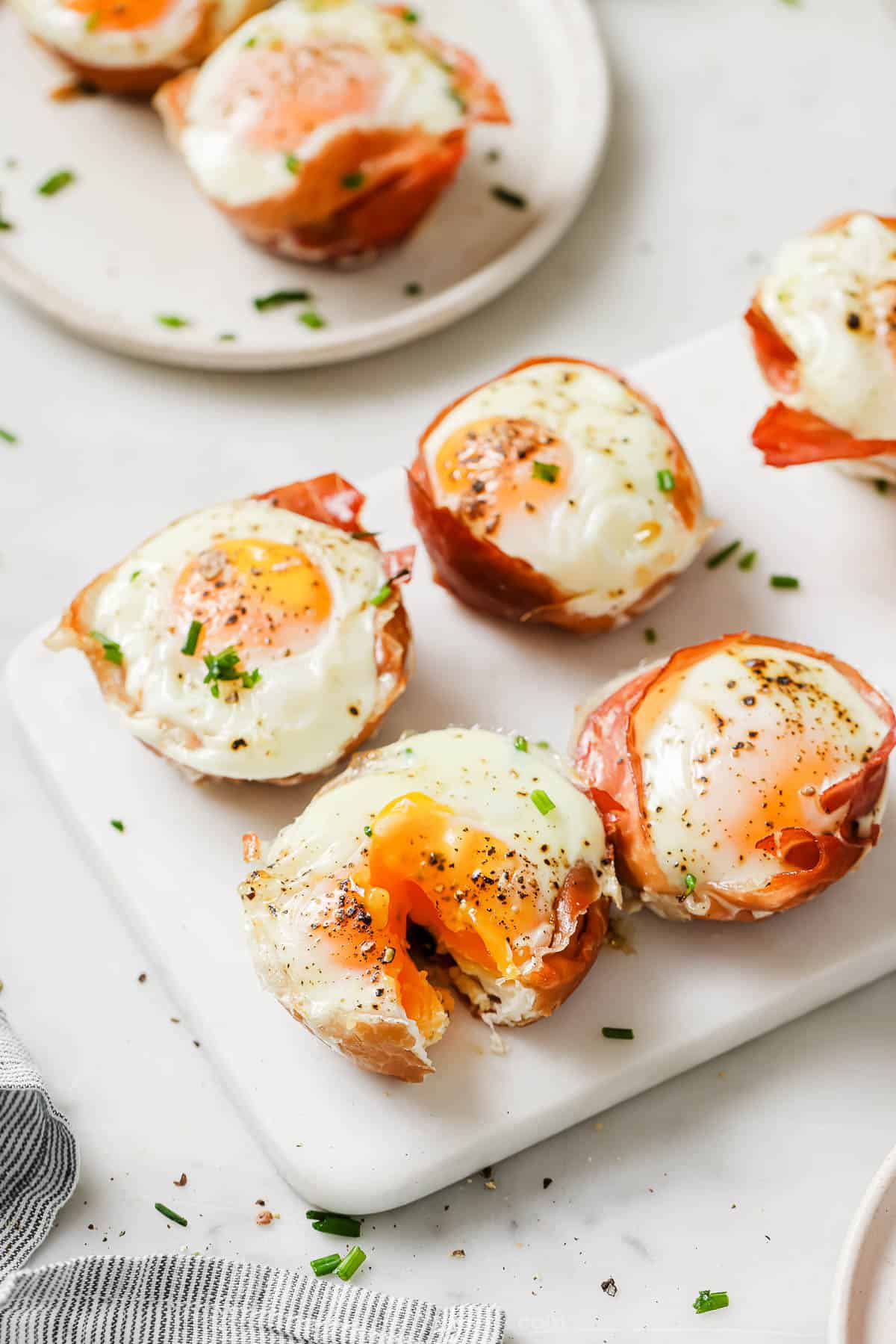 Four prosciutto egg cups.