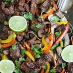Easy 30 Minute Sheet Pan Steak Fajitas topped with zesty chimichurri - everything is made on one pan for easy cleanup. These Steak Fajitas make a healthy delicious dinner that your family will love!
