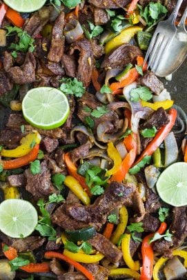 Easy 30 Minute Sheet Pan Steak Fajitas topped with zesty chimichurri - everything is made on one pan for easy cleanup. These Steak Fajitas make a healthy delicious dinner that your family will love!