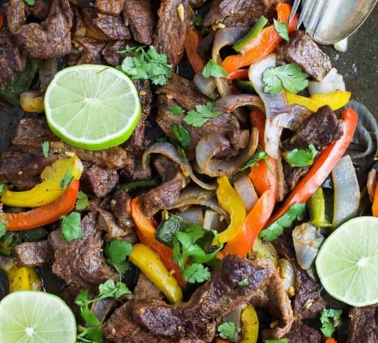 Easy 30 Minute Sheet Pan Steak Fajitas topped with zesty chimichurri - everything is made on one pan for easy cleanup. These Steak Fajitas make a healthy delicious dinner that your family will love!