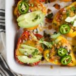 Cheesy Turkey Enchilada Stuffed Peppers filled with tex-mex flavor and covered in melty cheese. These gluten free Stuffed Peppers make an absolutely delicious healthy weeknight dinner for the family.
