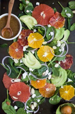 Winter Fruit Avocado Salad made with fresh citrus, avocado, spinach and goat cheese. This gorgeous citrus salad is done in 15 minutes and makes the perfect side for any meal!