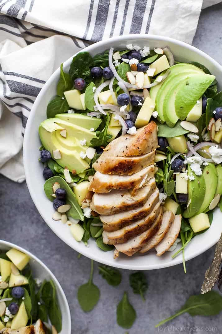 Top view of a bowl of Grilled Avocado Mango Chicken Salad