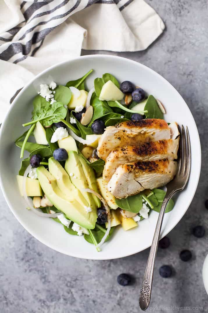 Top view of a bowl of Grilled Avocado Mango Chicken Salad