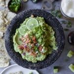 Creamy Bacon Guacamole - you'll love this twist on a classic. Crispy bacon pieces are the perfect addition to take this 5 minute guacamole over the top! It's a must have appetizer for your next party! {paleo, gluten free & keto friendly}