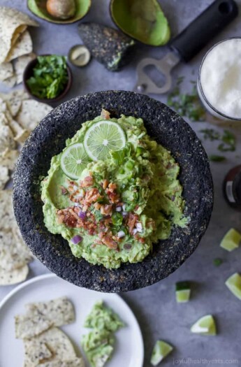 Creamy Bacon Guacamole - you'll love this twist on a classic. Crispy bacon pieces are the perfect addition to take this 5 minute guacamole over the top! It's a must have appetizer for your next party! {paleo, gluten free & keto friendly}