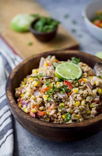 A delicious Farro Salad filled with Char Grilled Corn, Roasted Red Pepper and creamy goat cheese. Yup... it's incredible! It's the perfect side dish to bring to your next party or mid-week lunch.