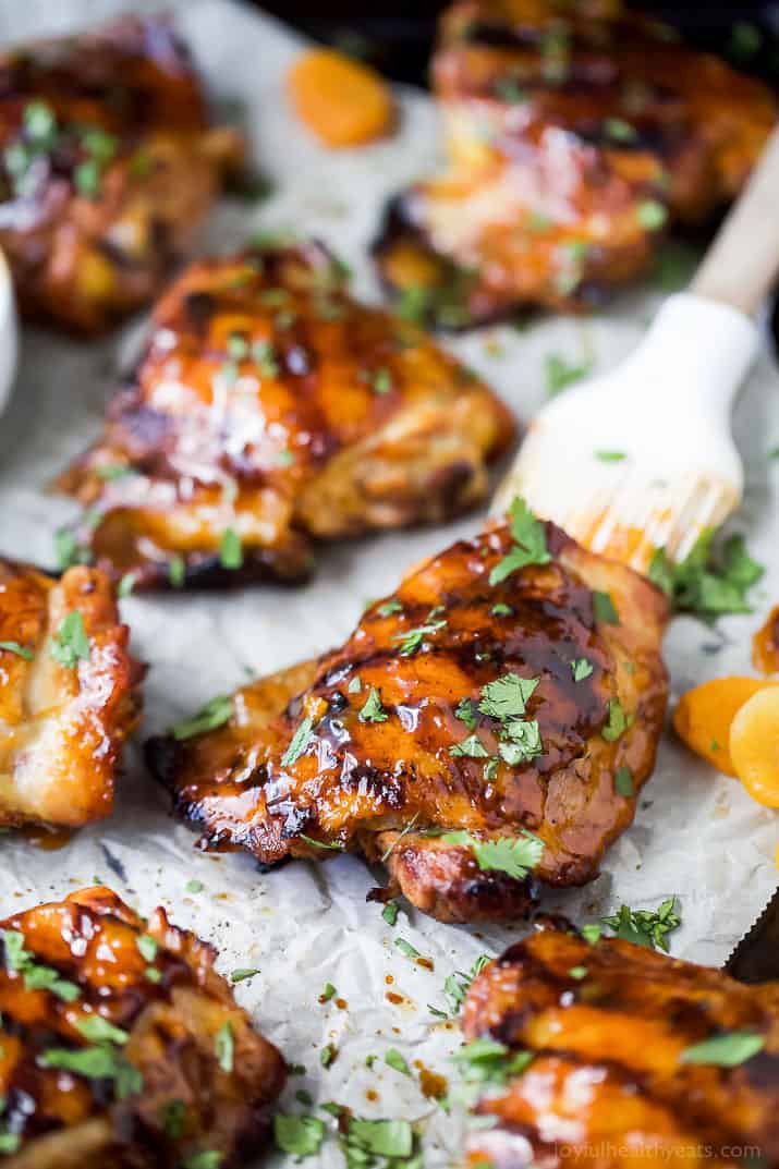 Chipotle Apricot Grilled Chicken Thighs on parchment paper