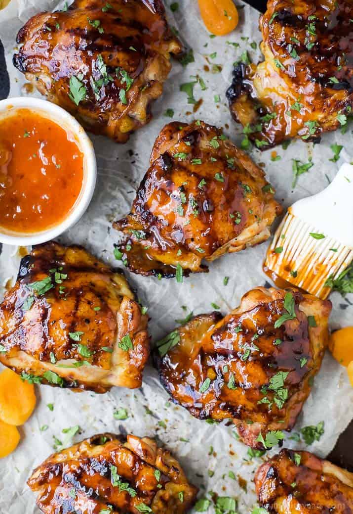 Top view of Chipotle Apricot Grilled Chicken Thighs on parchment paper