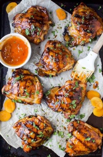 Sweet & Spicy CHIPOTLE APRICOT GRILLED CHICKEN THIGHS - juicy smoky chicken thighs slathered in an easy chipotle apricot glaze that will make you swoon! You'll be making this easy chicken recipe on repeat this summer.