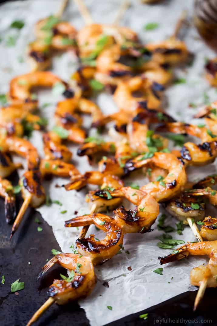 Easy 30 Minute Honey Garlic Grilled Shrimp with only 4 ingredients and full of bold flavors. These grilled shrimp will be a favorite this summer - I guarantee you'll be licking your fingers!