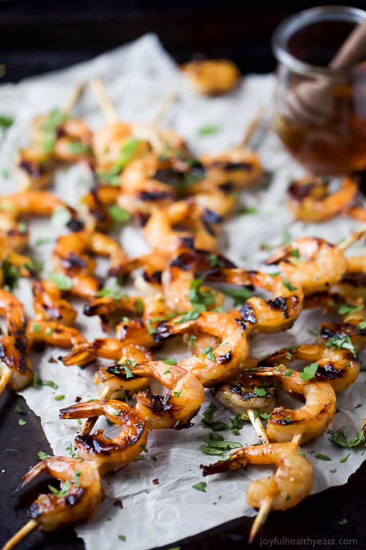 Easy 30 Minute Honey Garlic Grilled Shrimp with only 4 ingredients and full of bold flavors. These grilled shrimp will be a favorite this summer - I guarantee you'll be licking your fingers!