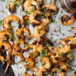 Easy 30 Minute Honey Garlic Grilled Shrimp with only 4 ingredients and full of bold flavors. These grilled shrimp will be a favorite this summer - I guarantee you'll be licking your fingers!