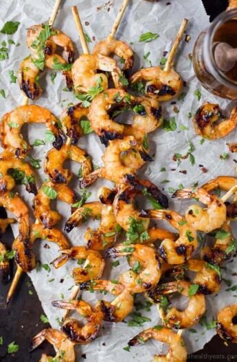 Easy 30 Minute Honey Garlic Grilled Shrimp with only 4 ingredients and full of bold flavors. These grilled shrimp will be a favorite this summer - I guarantee you'll be licking your fingers!