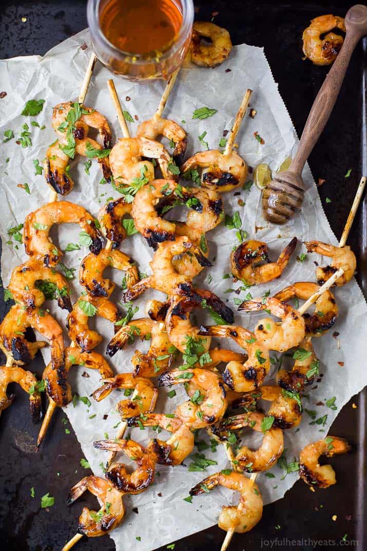 Easy 30 Minute Honey Garlic Grilled Shrimp with only 4 ingredients and full of bold flavors. These grilled shrimp will be a favorite this summer - I guarantee you'll be licking your fingers!