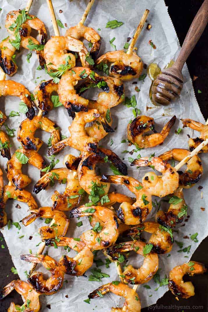 Easy 30 Minute Honey Garlic Grilled Shrimp with only 4 ingredients and full of bold flavors. These grilled shrimp will be a favorite this summer - I guarantee you'll be licking your fingers!