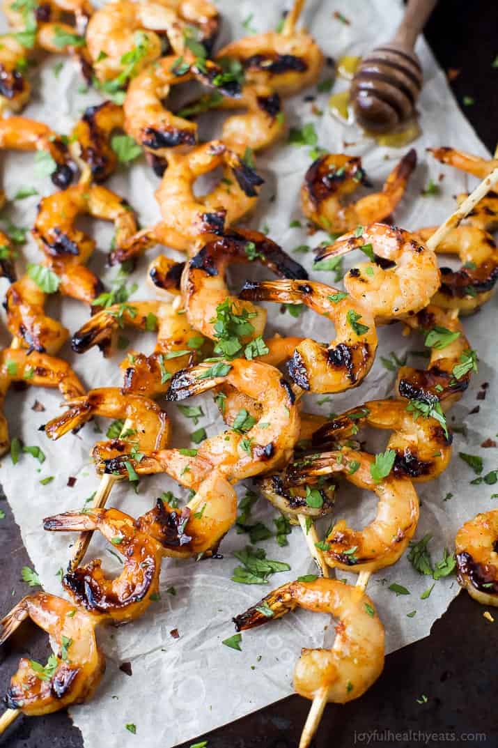 Easy 30 Minute Honey Garlic Grilled Shrimp with only 4 ingredients and full of bold flavors. These grilled shrimp will be a favorite this summer - I guarantee you'll be licking your fingers!