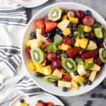 The BEST Summer Fruit Salad filled with loads of fresh fruit and dressing FREE. It's the perfect refreshing salad to have around all summer long that's naturally gluten free.