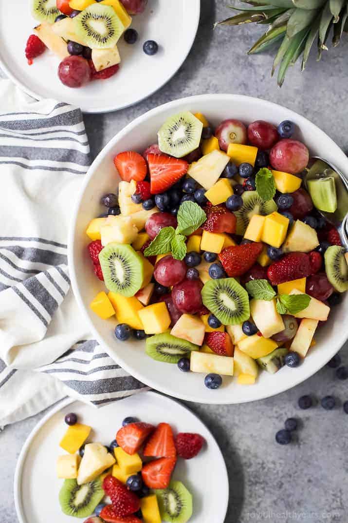 The BEST Summer Fruit Salad filled with loads of fresh fruit and dressing FREE.  It's the perfect refreshing salad to have around all summer long that's naturally gluten free.