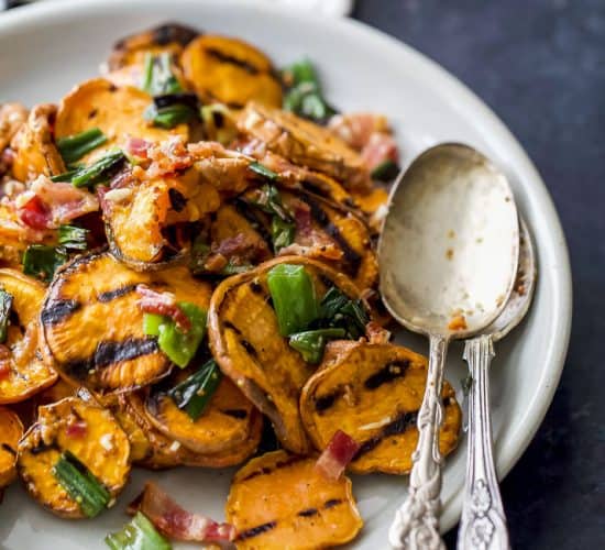 GRILLED SWEET POTATO SALAD with crispy bacon, grilled scallions and a tangy honey mustard dressing. This Potato Salad is so flavorful, easy to make, gluten free, paleo and the perfect side dish to bring this summer!