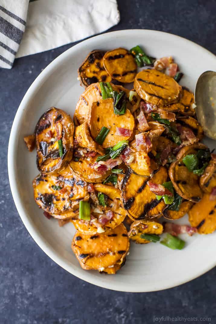 Top view of GRILLED SWEET POTATO SALAD with crispy bacon and grilled scallions on a plate