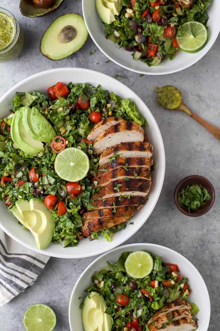 Three white bowls filled with a healthy Chopped Salad with Grilled Chicken 