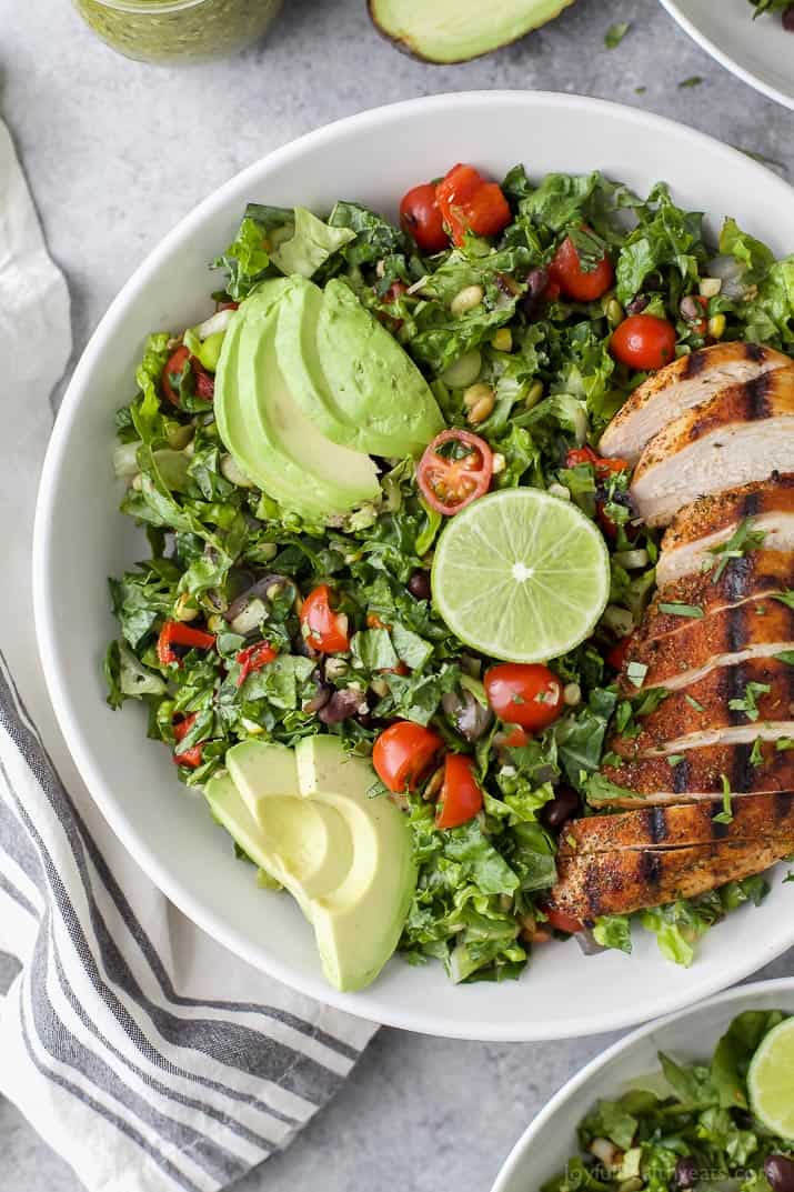 Close up of fresh Mexican Chopped Salad with Grilled Chicken and Poblano Dressing in a white bowl