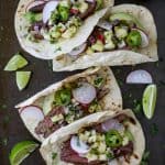The BEST Steak Tacos ever made with a surprise ingredient for a sweet salty marinade you'll adore. Top these tender Steak Tacos with a Radish Pineapple Salsa for one delicious finish! Guaranteed to be your favorite!