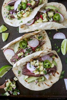 The BEST Steak Tacos ever made with a surprise ingredient for a sweet salty marinade you'll adore. Top these tender Steak Tacos with a Radish Pineapple Salsa for one delicious finish! Guaranteed to be your favorite!