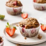 A strawberry ،in on a plate.