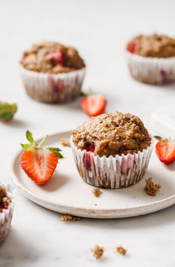 A strawberry muffin on a plate.