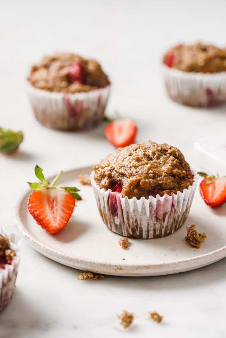 A strawberry muffin on a plate.