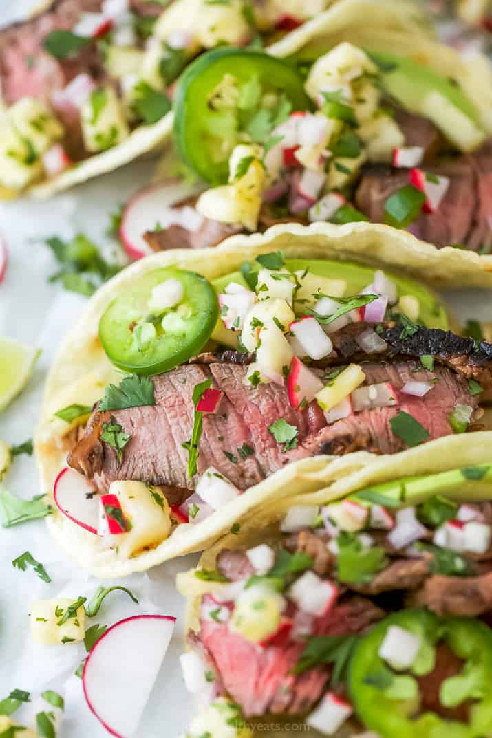 side photo of grilled steak tacos with pineapple salsa