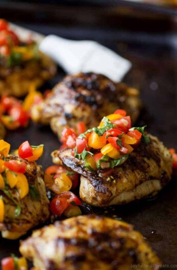 Balsamic Grilled Chicken Thighs topped with a fresh tomato Bruschetta. An easy 30 minute meal that will quickly become the ultimate grilling recipe you'll want all summer! #ad #glutenfree #paleo