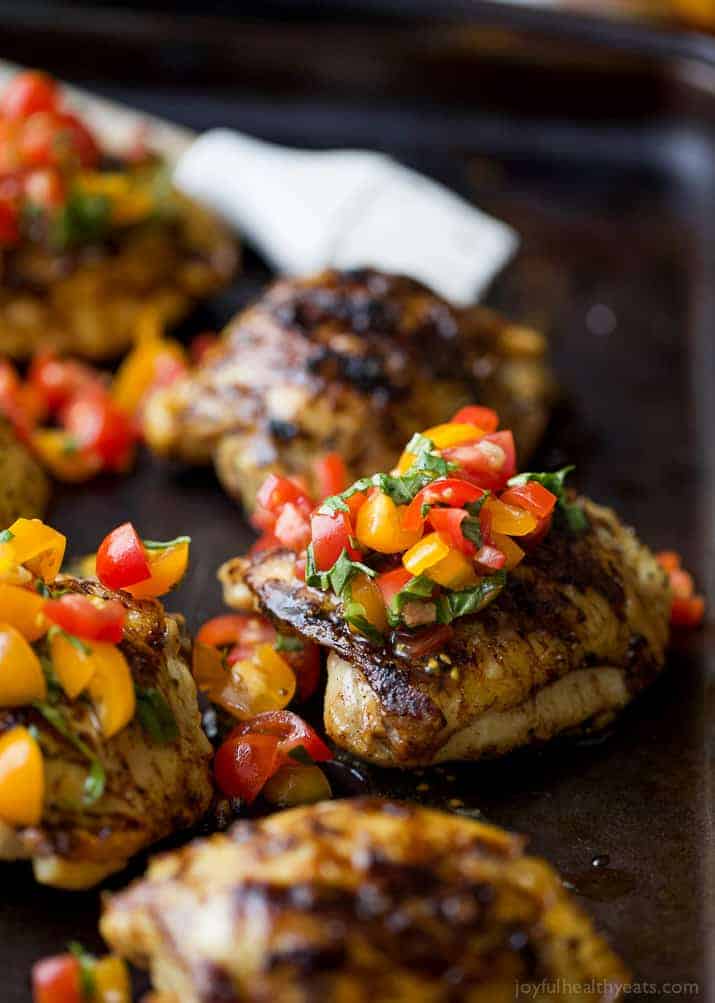 Balsamic Grilled Chicken Thighs topped with a fresh tomato Bruschetta
