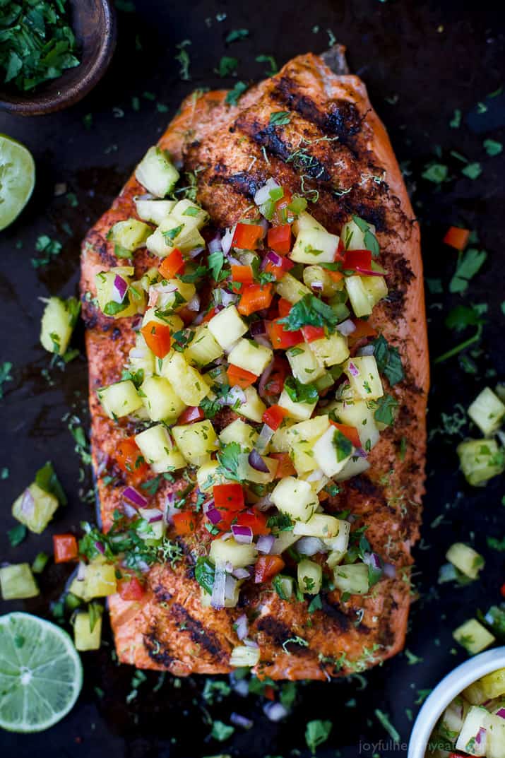 Top view of Chili Lime Grilled Salmon topped with fresh Pineapple Salsa