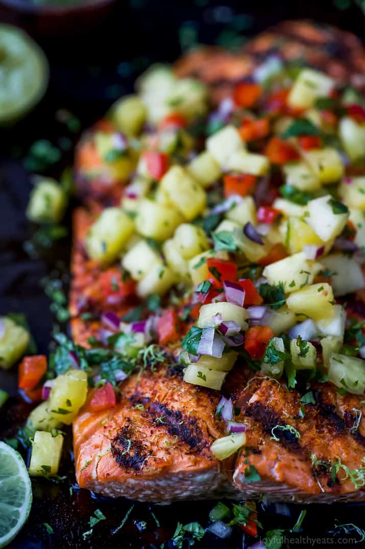 Close-up of Chili Lime Grilled Salmon topped with fresh pineapple salsa