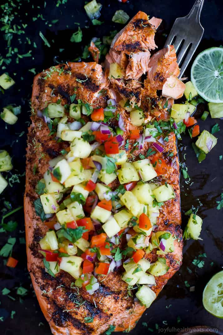 Top view of Chili Lime Grilled Salmon topped with fresh pineapple salsa