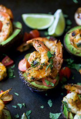 Easy 30 Minute Grilled Cilantro Lime Shrimp served in a Grilled Avocado Boat. This light & flavorful recipe makes the perfect party appetizer or main dish for the summer!