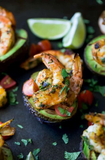 Easy 30 Minute Grilled Cilantro Lime Shrimp served in a Grilled Avocado Boat. This light & flavorful recipe makes the perfect party appetizer or main dish for the summer!