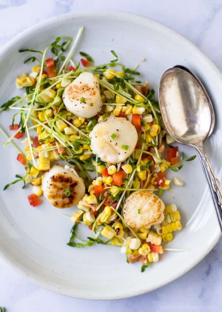 Seared Scallops with Corn Relish filled with pea sprouts, bacon and red pepper. An easy light recipe that screams summer with an easy "how to" to ensure you get perfectly seared scallops every time. #glutenfree